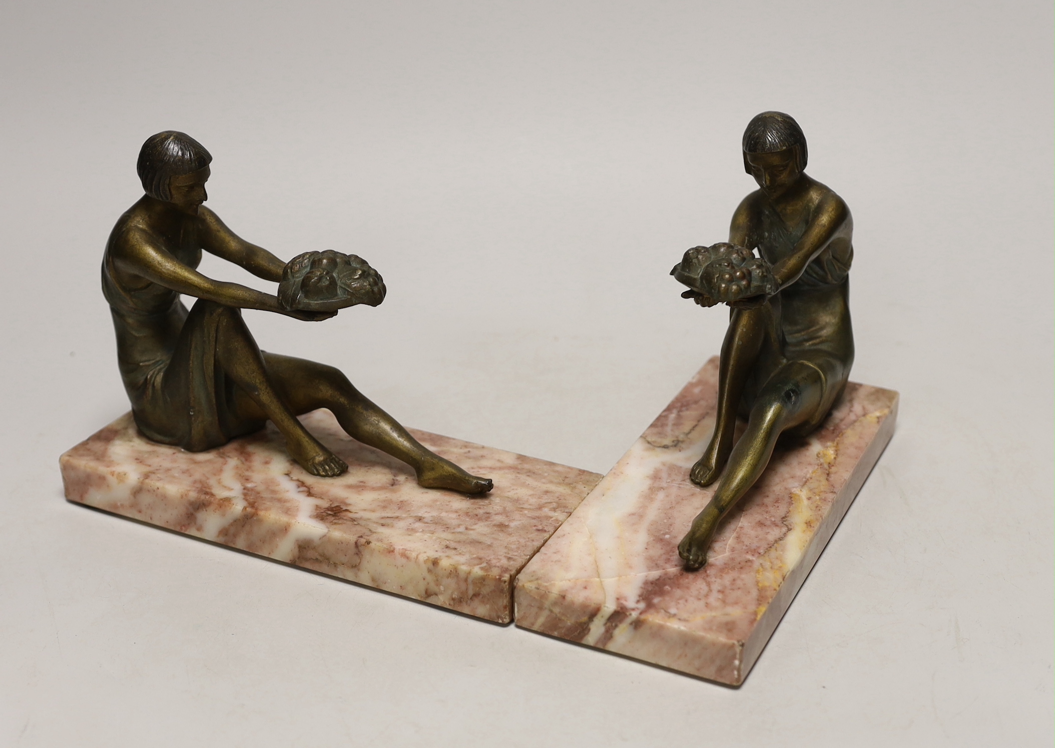 A pair of French Art Deco gilt metal and marble figural bookends, 20cm long